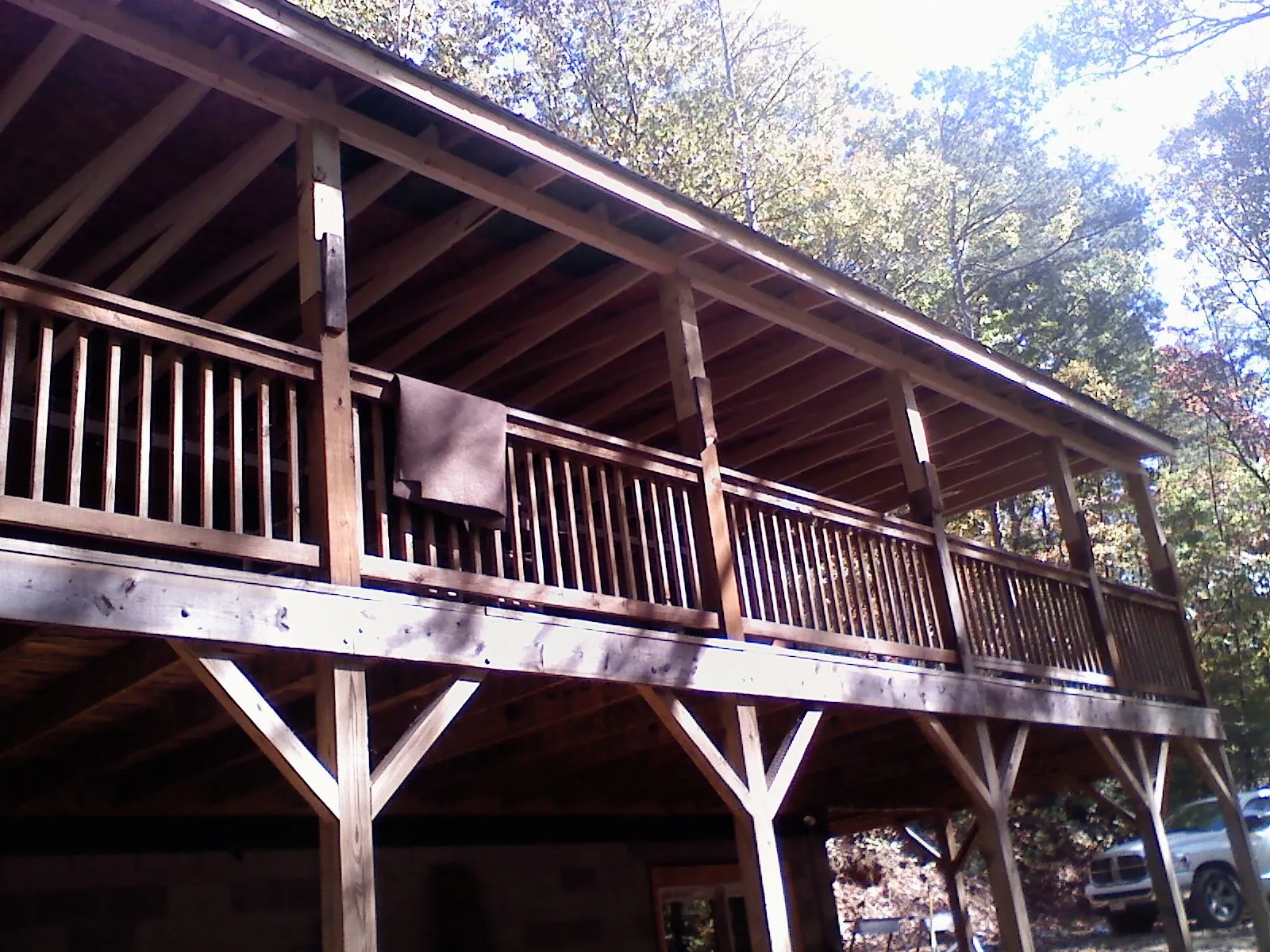 Timber framing under a new elevated porch and deck — Roof Leak Repair in Galt by Roofing Brothers